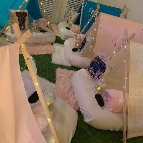 Slumberr Party with small teepees and fairy light decorations